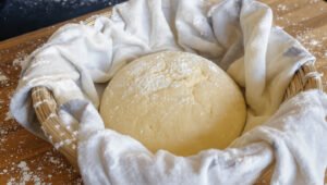 shape your dough into a ball in a bowl with sprinkled flour